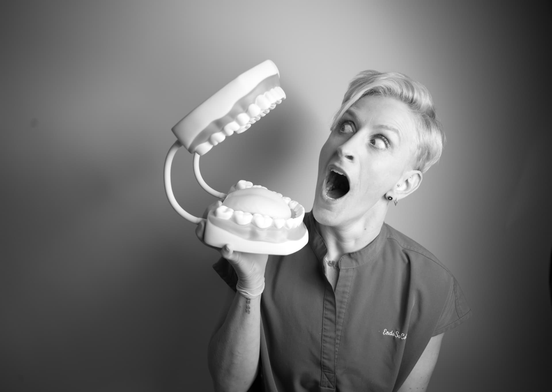 Dr. Valerie Kanter holding an oversized dental model